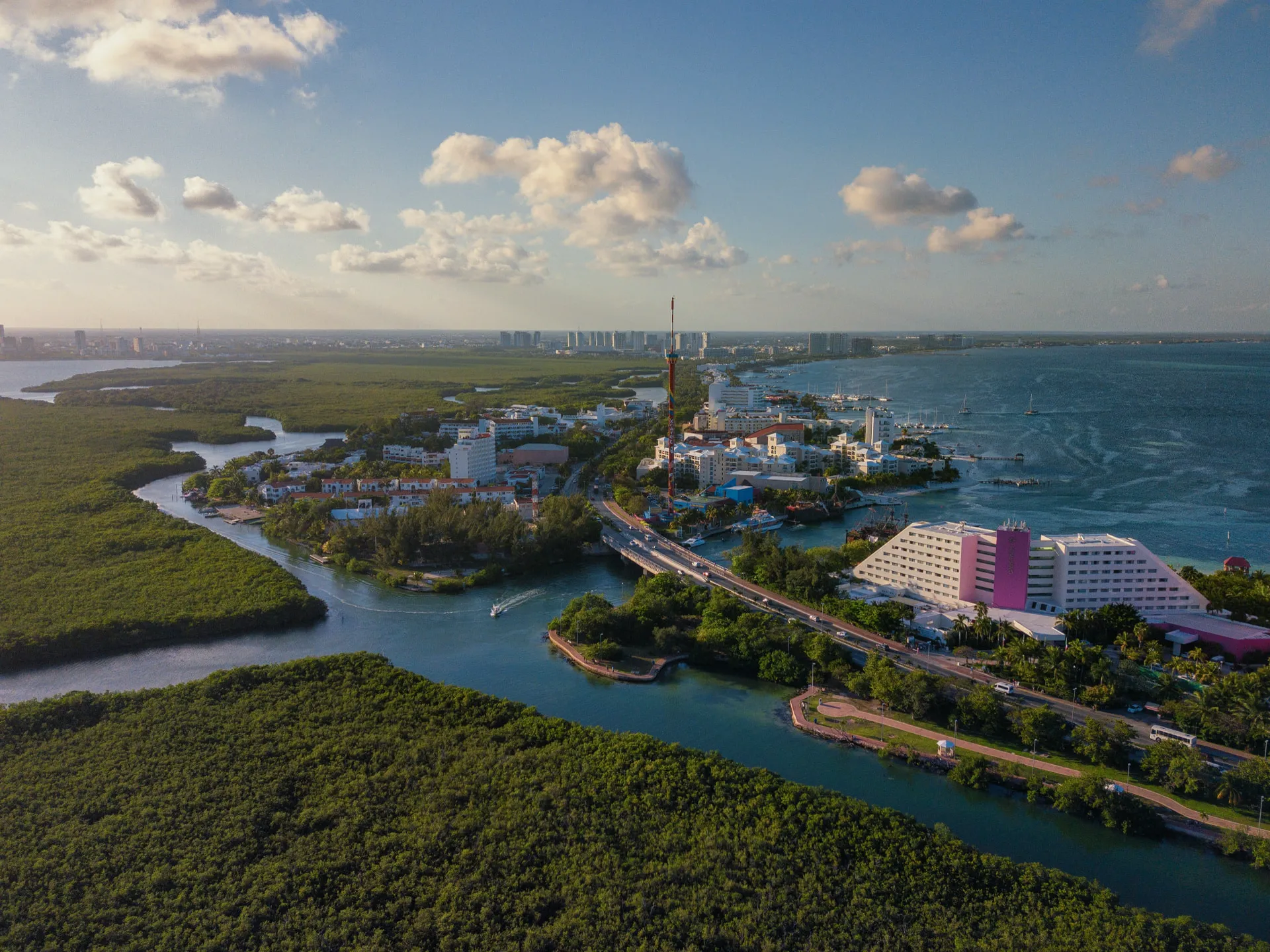 Aerial view of Cancún showing the coastline, lagoon, bridges and urban area
